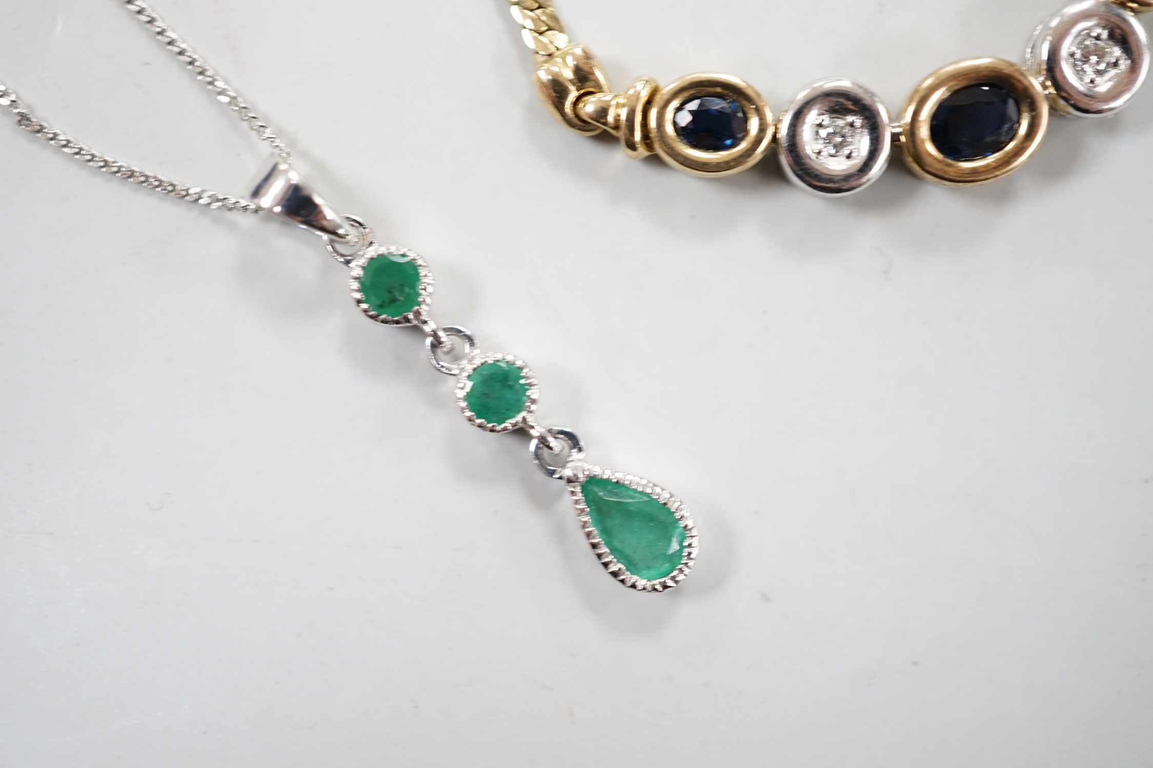 Four assorted modern 375 and gem set pendant necklaces, including white 375 and diamond chip set, 50cm and white 375 and emerald drop set, gross weight 11.3 grams.